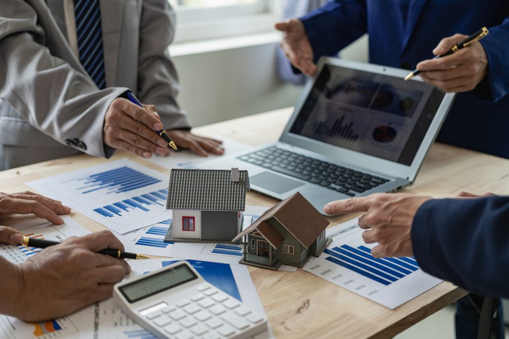Business meeting of real estate brokers Businesses working with new startup projects Marketing concept presentation analysis plan Close-up pictures